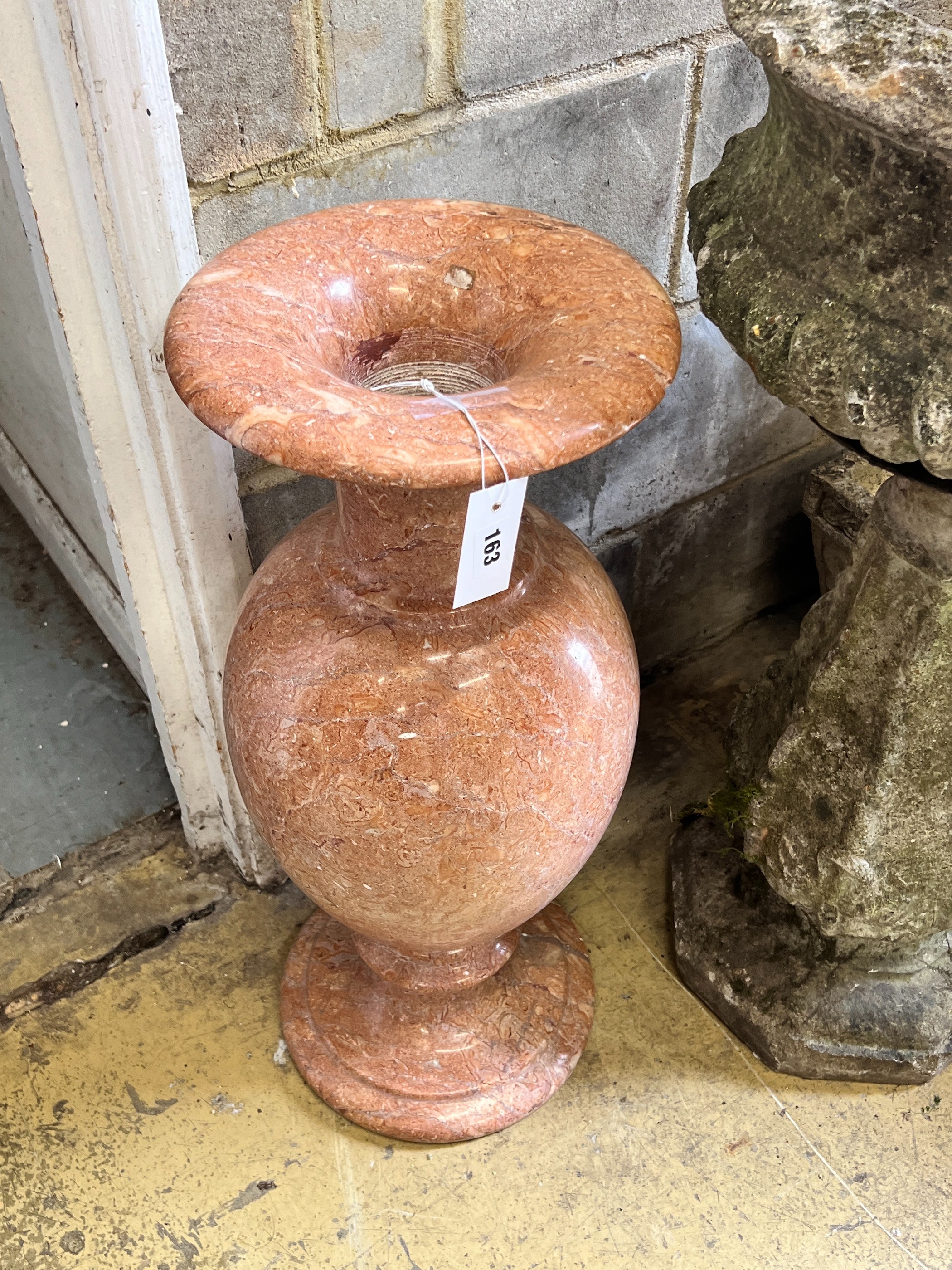 A reconstituted marble urn, height 70cm